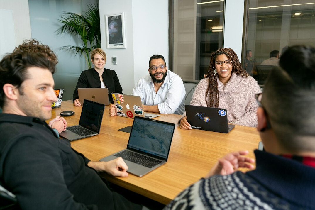 corporate team discussing software