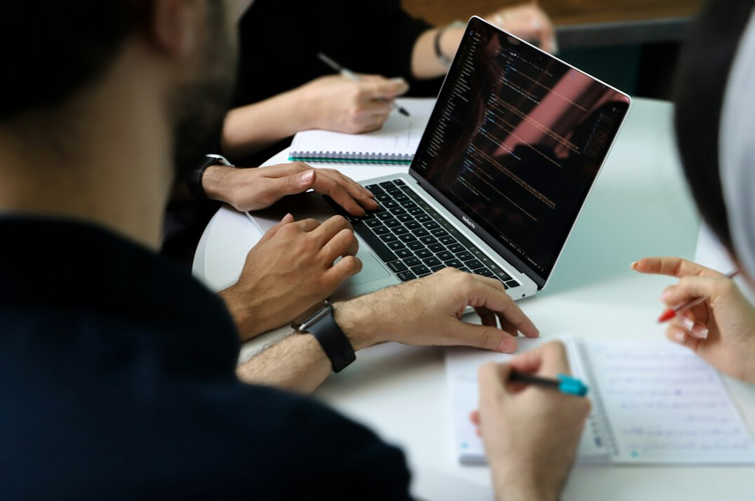 corporate team discussing software