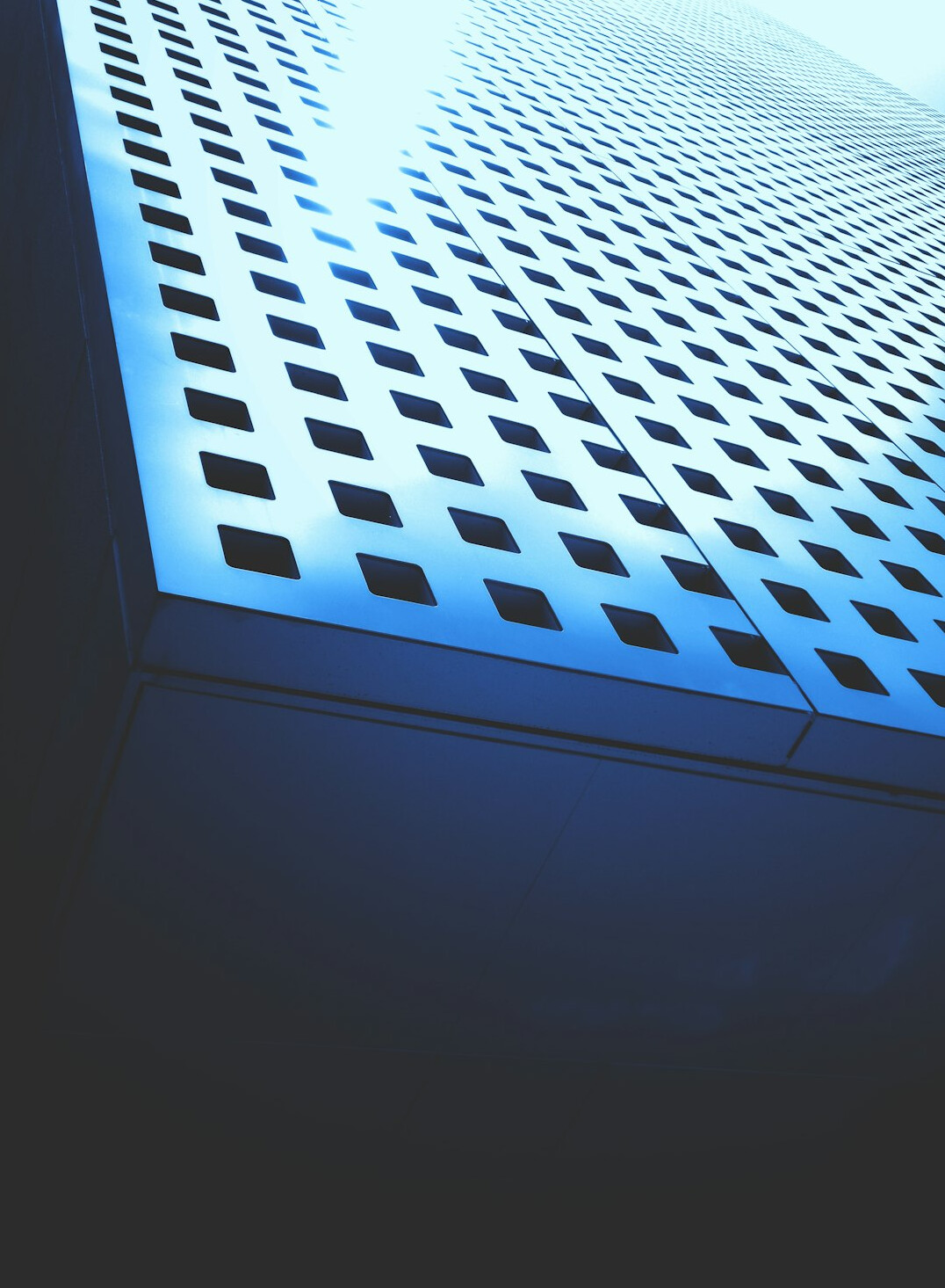 Rows of servers in a corporate data center with blue lighting